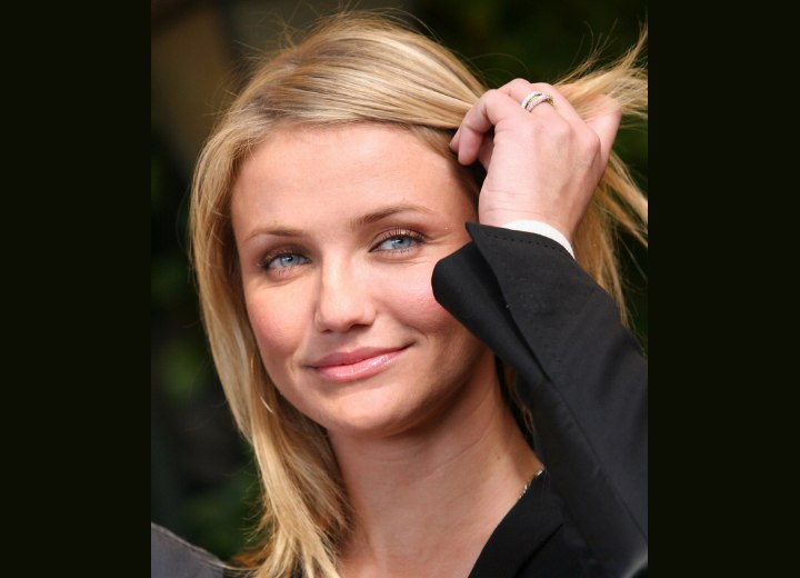 Cameron Diaz touching her hair