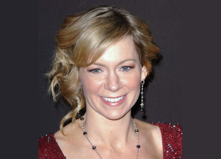 Carrie Preston wearing her hair in a dressy up style with curls