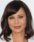 Catherine Bell sporting a medium length wavy bob with side swept bangs