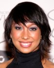 Cheryl Burke sporting a medium length haircut with lots of motion