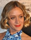 Chloë Sevigny wearing her hair in a just over the ears bob with curls