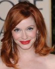 Christina Hendricks wearing her red hair in a sixties style