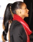 Ciara's hair smoothly brushed back and styled into a high ponytail