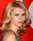 Claire Danes with her medium length hair styled into large curls around her face