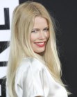 Claudia Schiffer sporting smooth loong hair with a middle part