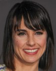 Brunette Constance Zimmer wearing a long bob with bangs