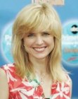 Courtney Thorne Smith sporting shoulder length hair with feathered bangs