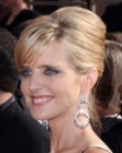 Courtney Thorne-Smith's updo with a banana roll in the back