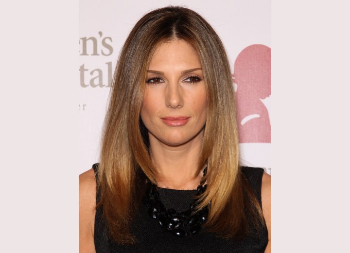 Daisy Fuentes wearing her hair long and smooth