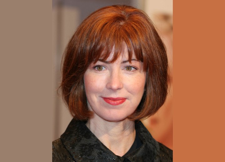 Dana Delany's chin length bob hairstyle with bangs