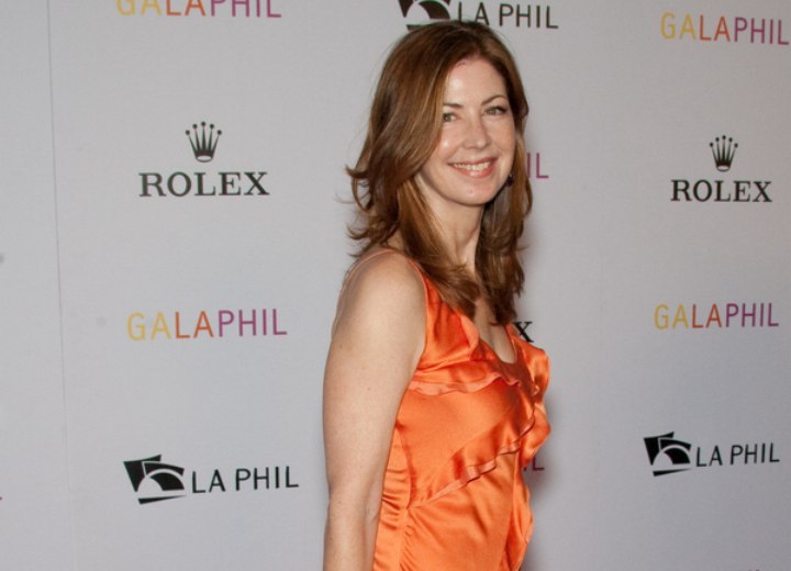 Dana Delany wearing a sleeveless organza gown