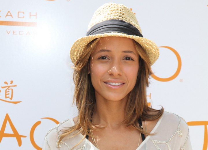 Dania Ramirez wearing a straw hat