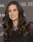 Demi Moore with her hair long and curly