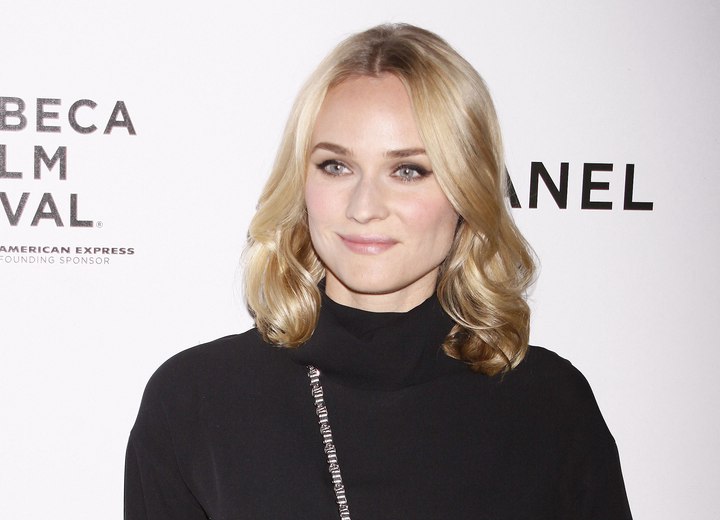 Diane Kruger wearing a black turtleneck blouse