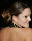 Drew Barrymore wearing her hair in a bun