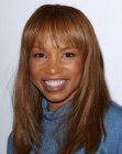 Elise Neal's long and simple to fix hairstyle with bangs