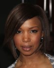 Elise Neal wearing a collar length bob with side bangs