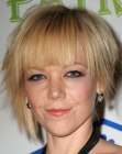 Emily Bergl with her hair cut short and slithered by a razor tool