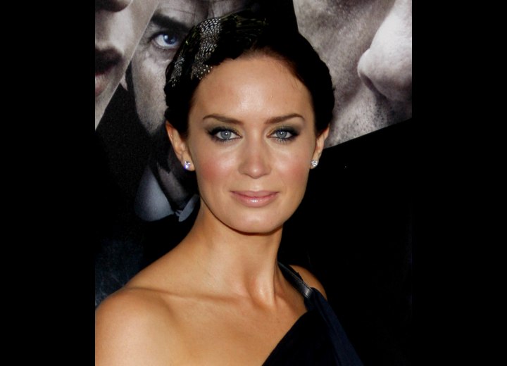 Emily Blunt wearing her hair back in a chignon