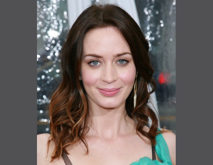 Emily Blunt with her hair parted in the center and curls