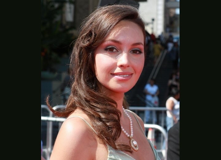 Emily O'Brien with her long hair styled over one shoulder