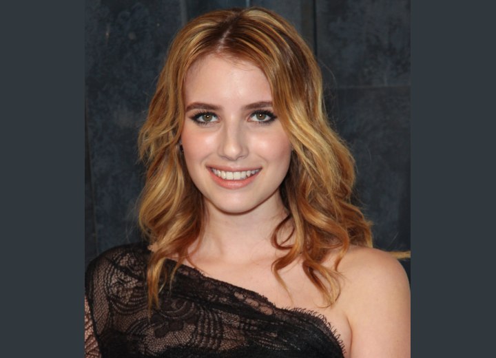 Emma Roberts with her hair styled into curls