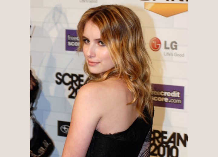 Emma Roberts - Long hair with curls resting upon her back