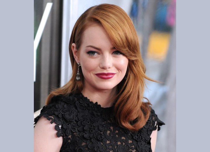 Emma Stone's long russet hair that matches her skin tone