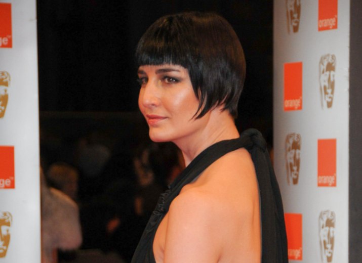 Erin O'Connor's with her hair in a traditional short bob 