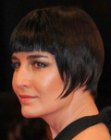 Erin O' Connor wearing a bob with bangs that expose her eyebrows