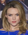 Erin Richards with her hair in a long style with layers and height