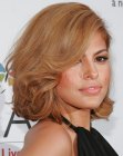 Eva Mendes wearing medium length hair with large curls