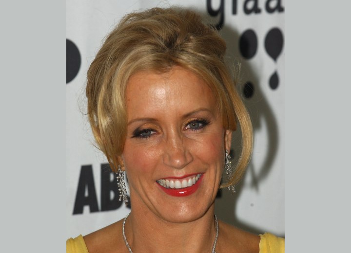 Felicity Huffman wearing her blonde hair in an elegant updo