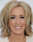 Felicity Huffman's mid length hair with layers and cut just above the shoulders