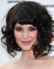 Gemma Arterton's medium length hair with large curls and short bangs