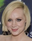 Gwendoline Christie with her blonde hair cut into a short bob with side bangs