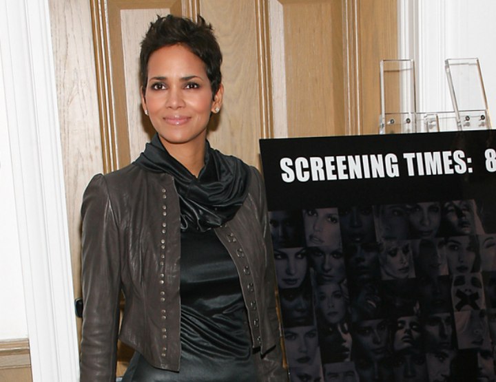 Halle Berry wearing a shiny black mini dress