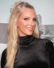 Heather Morris wearing her hair long with a top knot