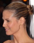 Heidi Klum with her hair pulled into a knotted bun