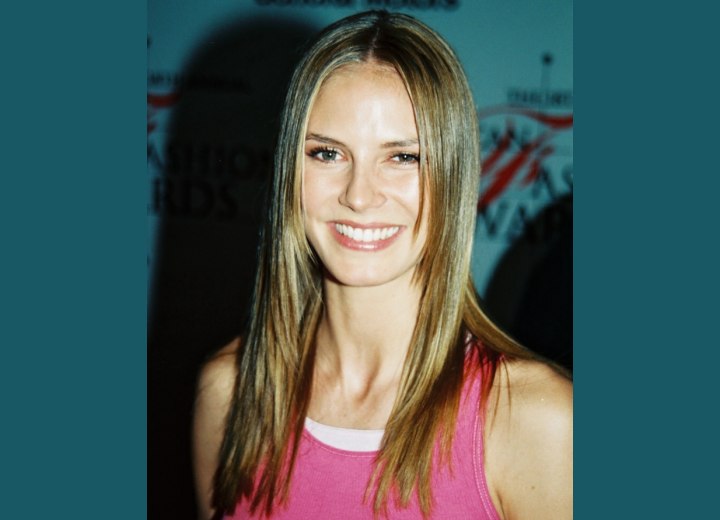 Heidi Klum - Long sleek hairstyle ith a middle part