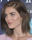Hilary Rhoda sporting medium length brown hair with layered ends