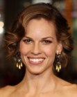 Hilary Swank's short hairstyle with bouncy curls