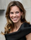 Hilary Swank sporting long hair with curls around the shoulders