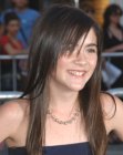 Isabelle Fuhrman wearing her long brunette hair in a smooth style