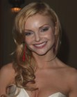 Izabella Miko with her long hair styled into large spirals