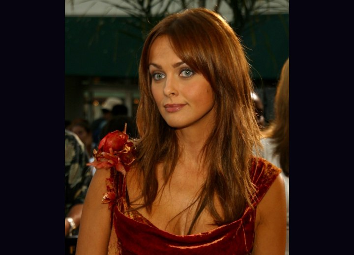 Izabella Scorupco with long tapered hair