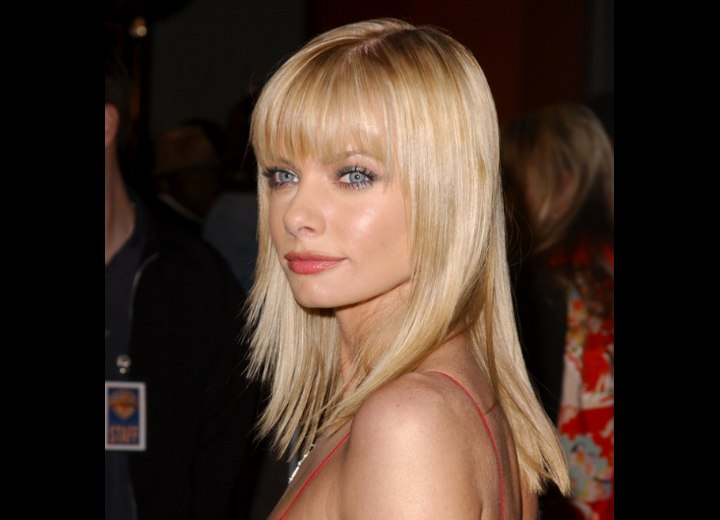 Jaime Pressly wearing her hair long with the sides cut 