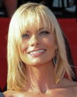 Jaime Pressly's blonde medium length hair with long choppy bangs