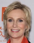 Jane Lynch with her hair cut in a collar length shag