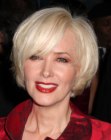 Janine Turner's blonde chin length bob with long bangs